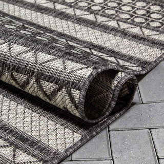 Arwen Tribal Indoor/Outdoor Black Textured Rug: 7'10" x 9'10"